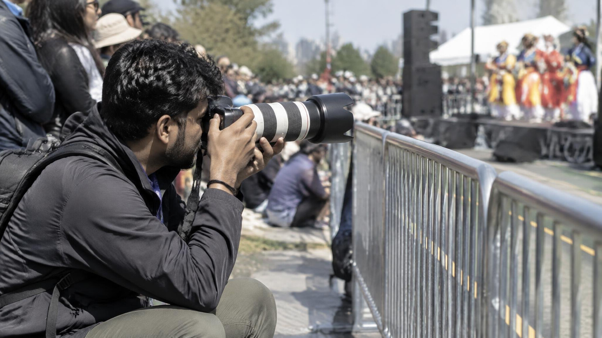 Photographer capturing a live public event